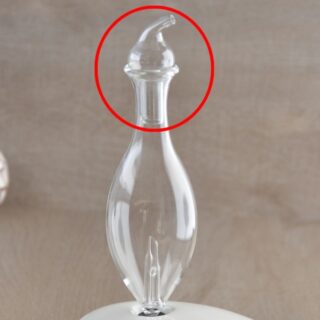 Capuchon orientable en verre